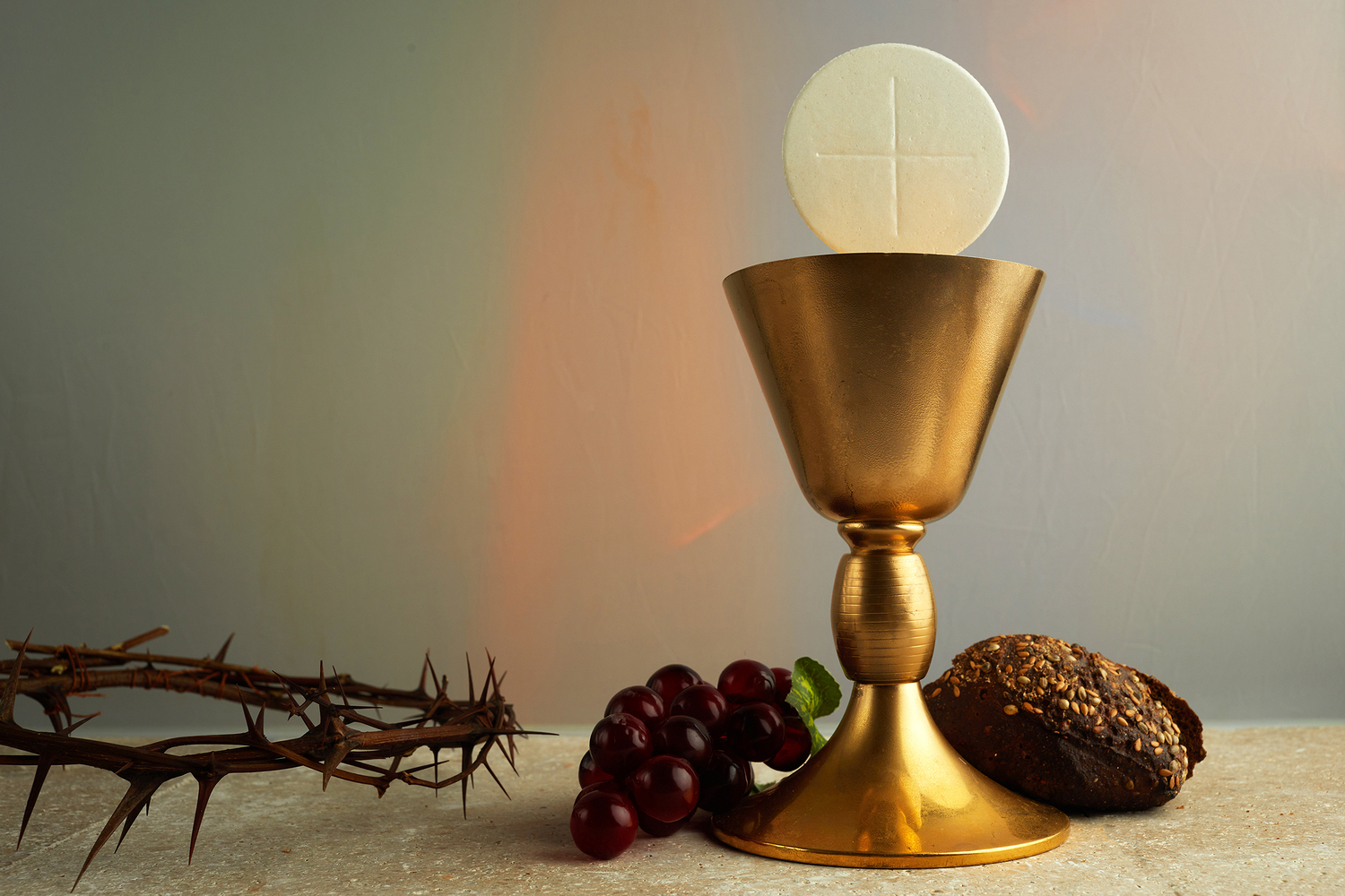 Easter background with crown of thorns and Chalice with red wine as concept for Christ blood.
